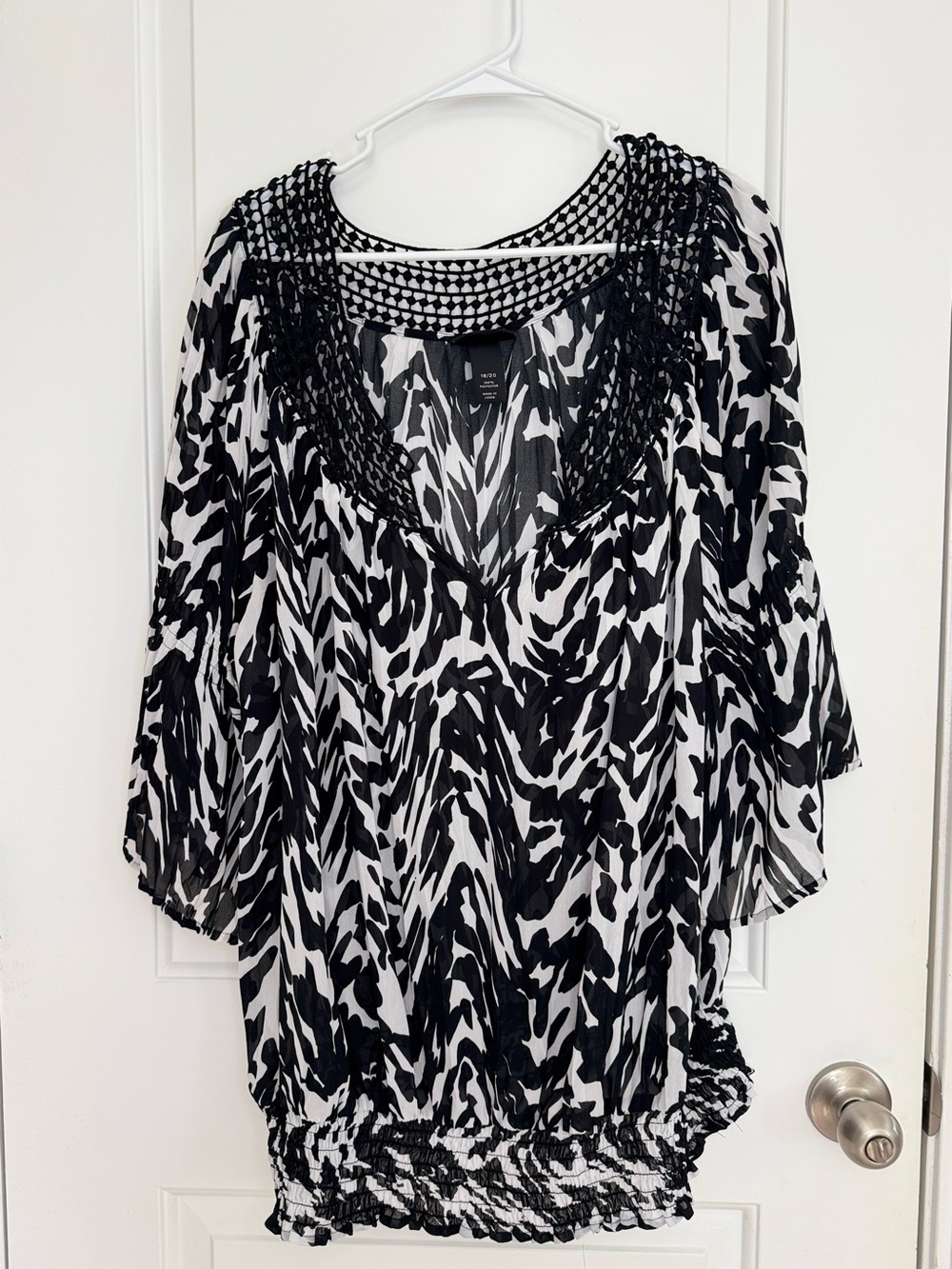 Lane Bryant zebra print Sheer blouse  a black lace neckline and elastic waist.